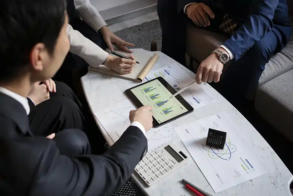 business people working with ipad high angle img