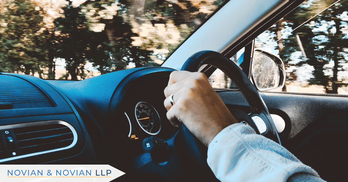 Uber driver on the road illustrating accident risks and injury settlements